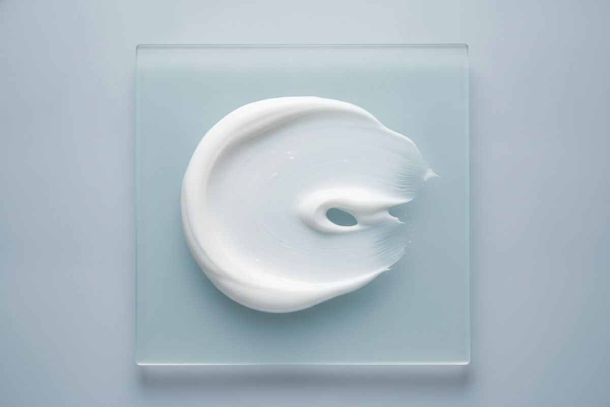 A swatch of cream on glass